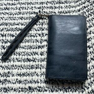 Barely used leather wallet with built in battery pack charger for iPhones!